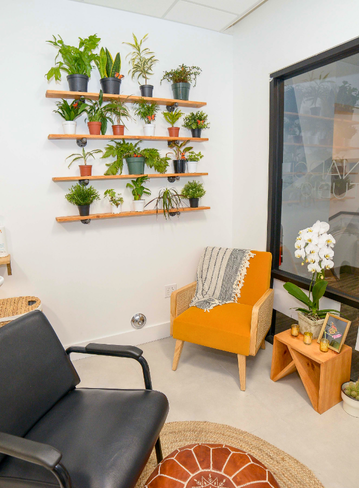 Fully equipped salon suite with hair stylist chair and mirror at Broadway La Mesa