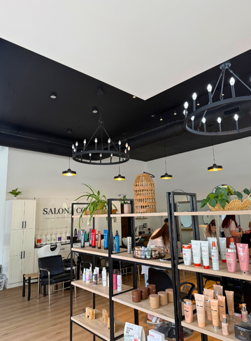 Fully equipped salon suite with hair stylist chair and mirror at Broadway Royal Oak, MI