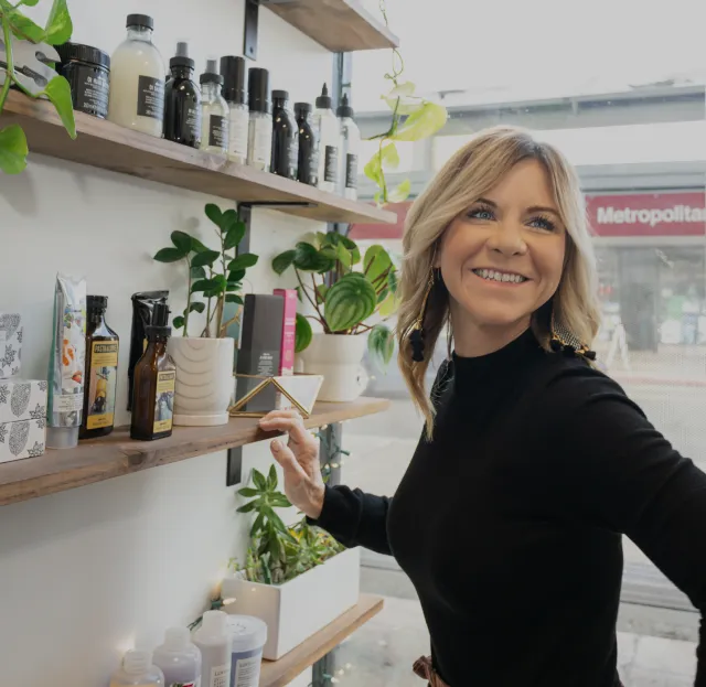 stylist smiling while gathering supplies